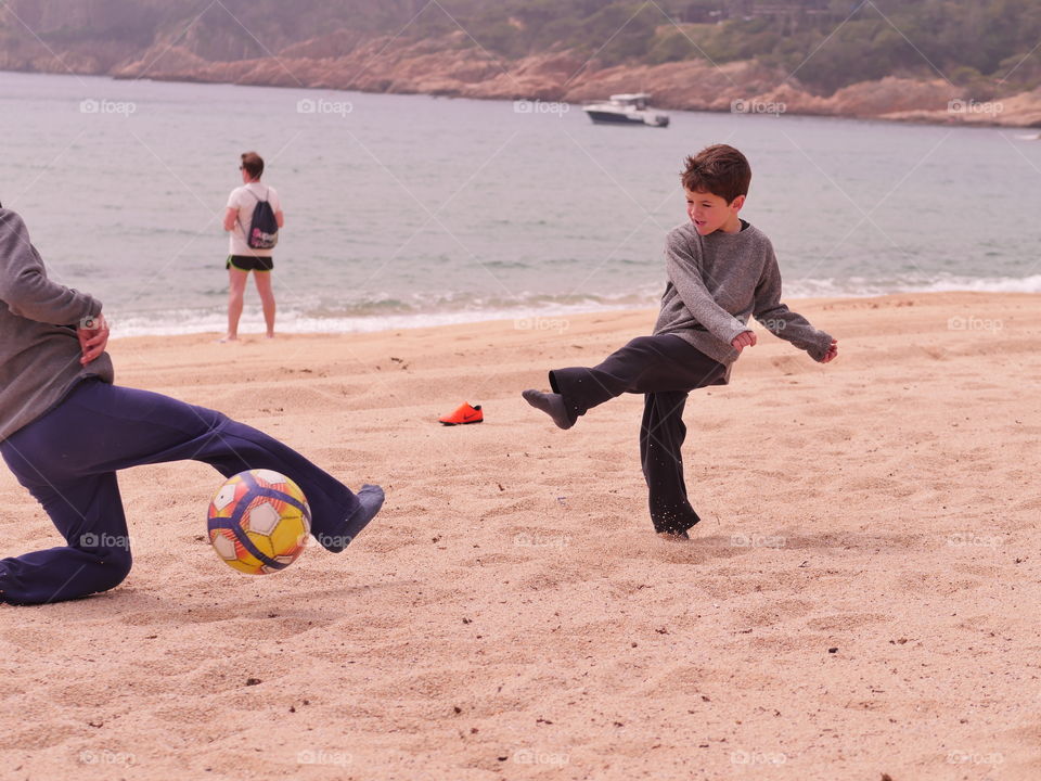 two child's play in the beach