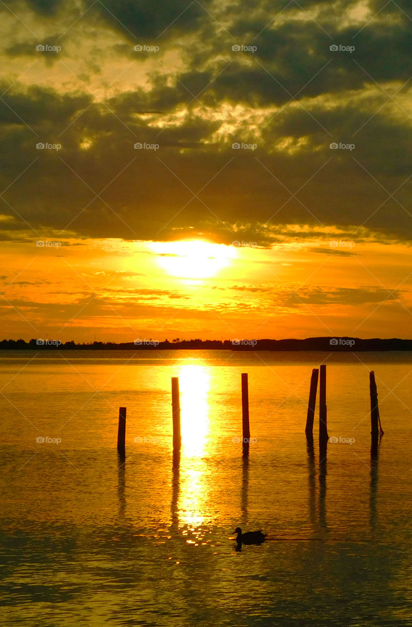 Reflection of sun on lake