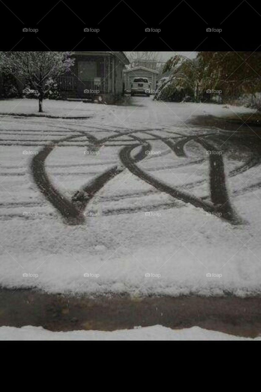 Two hearts made by a car 