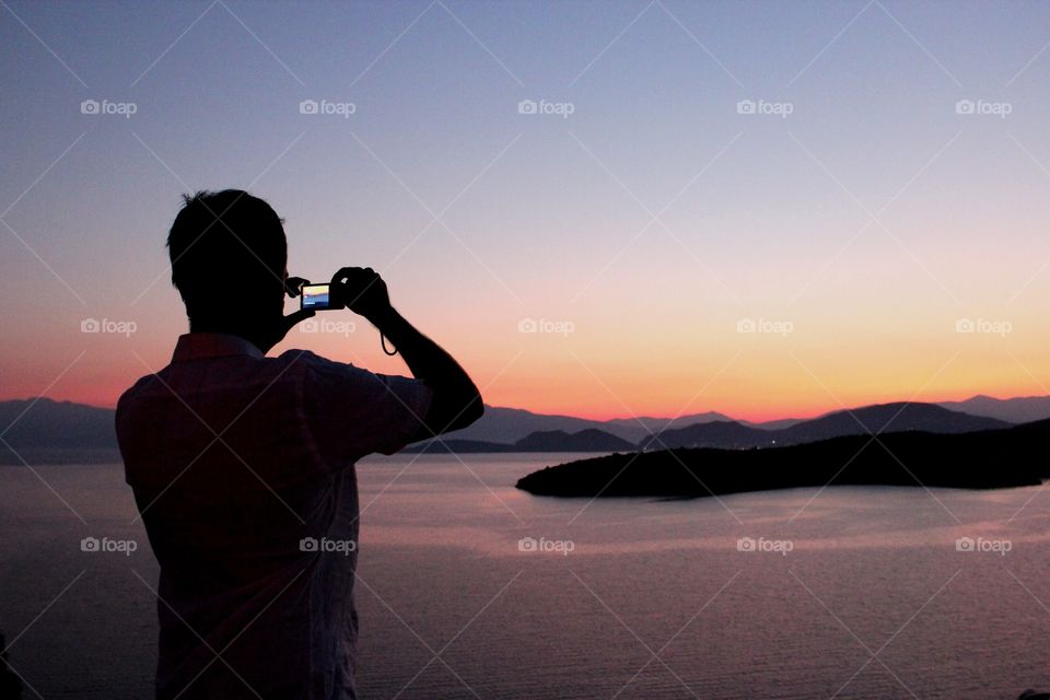 Taking photo of the sunset