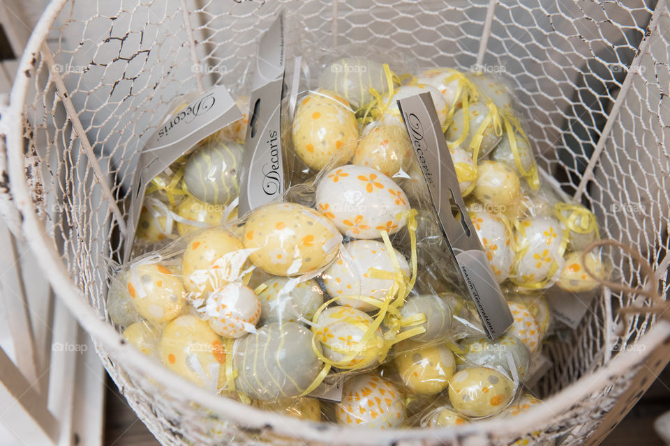 Easter decoration eggs in basket on sale at local store.