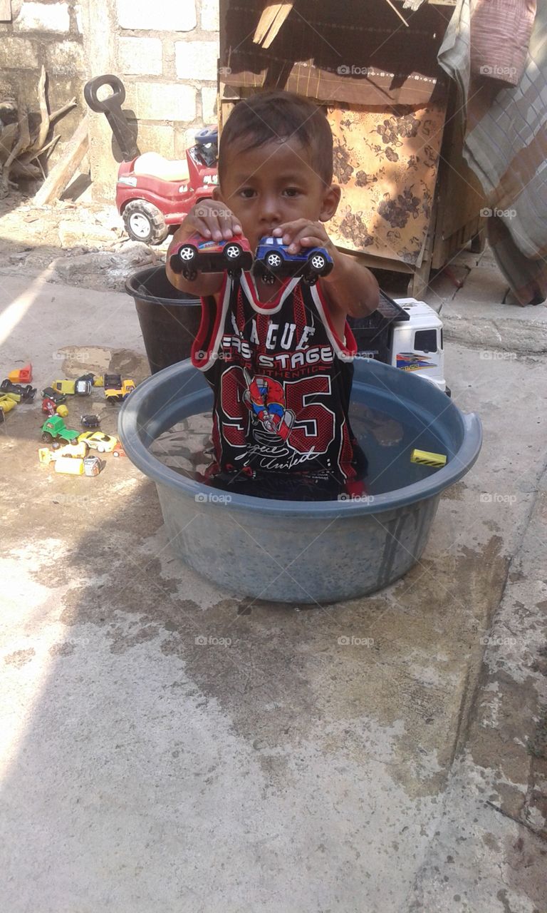 boy playing water
