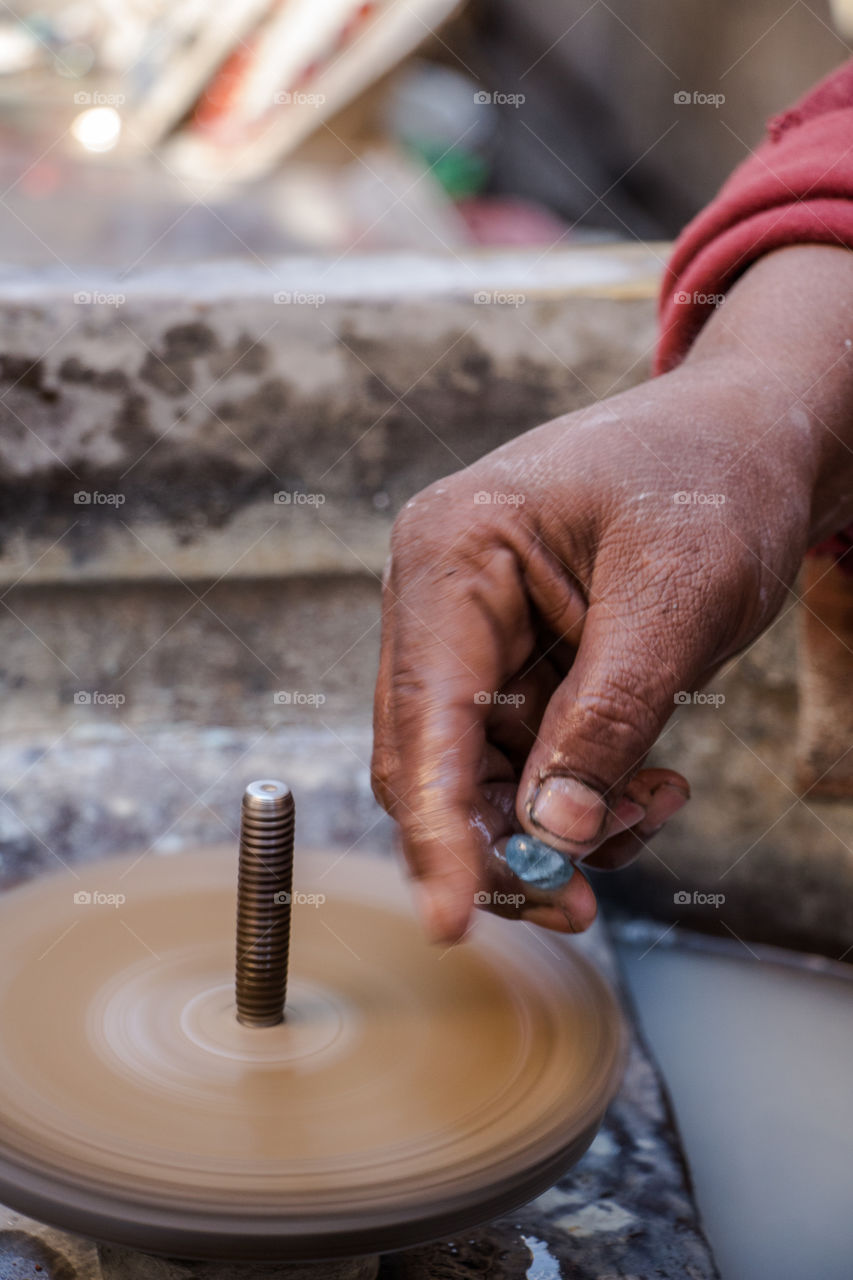 Person shaping gem's