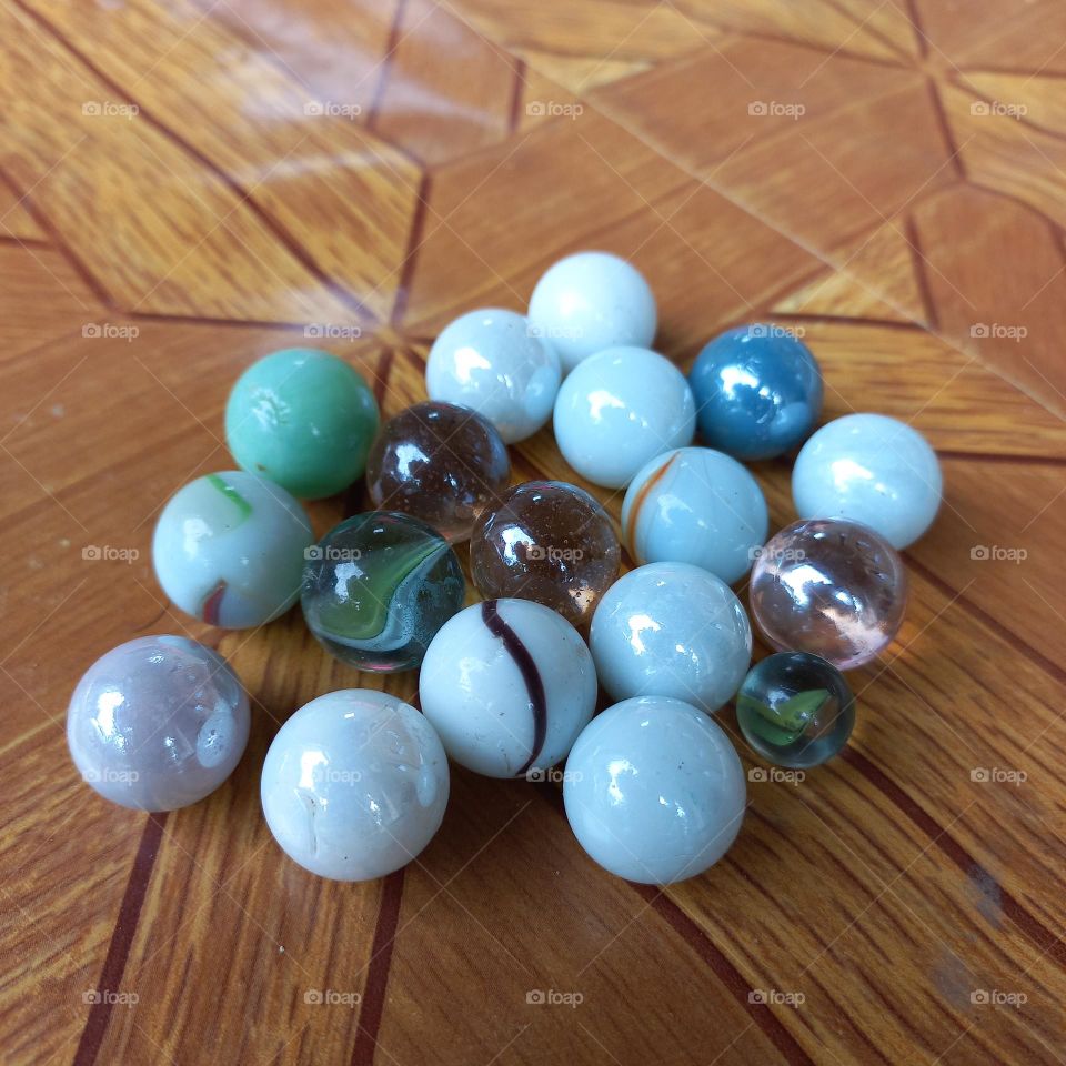 Small balls made of marble or glass clay for children's games