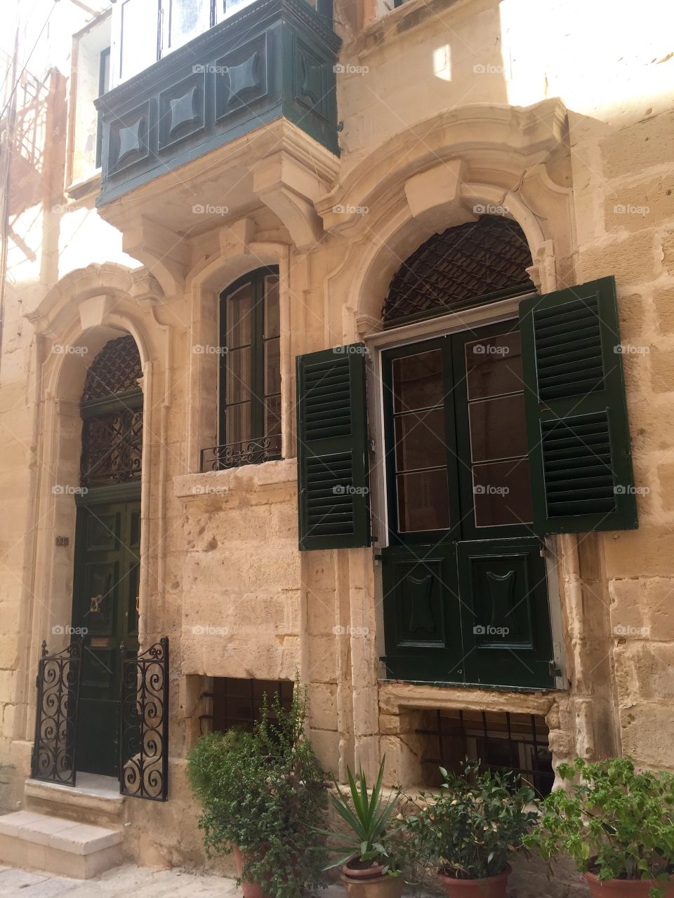 Windows around the world . Shutters around a window in the Birgu/Vittoriosa in The Three Cities area of Malta.