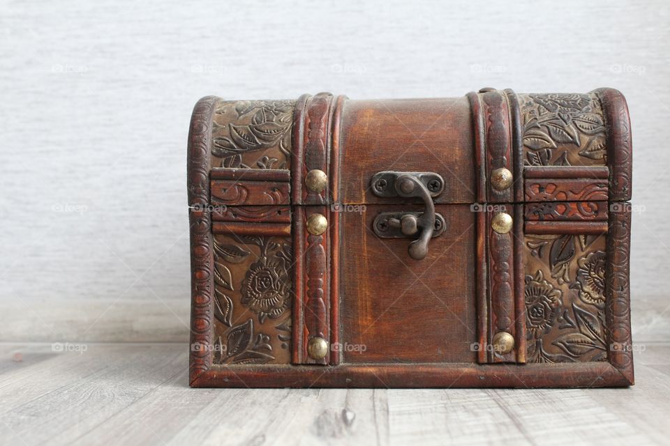 Wooden trunk on wooden table.