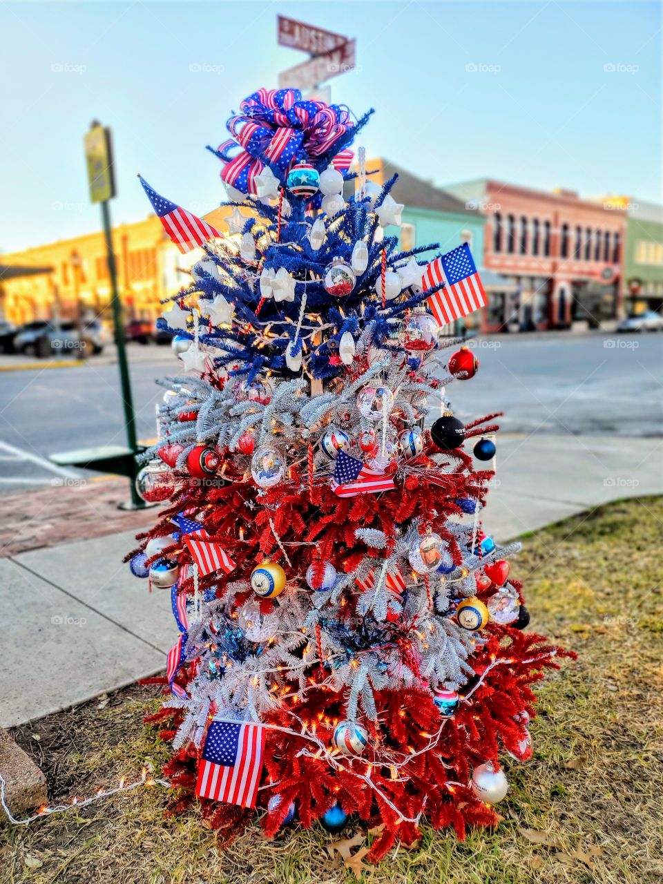 Patriotic red white and blue Christmas tree honoring the various branches of the military