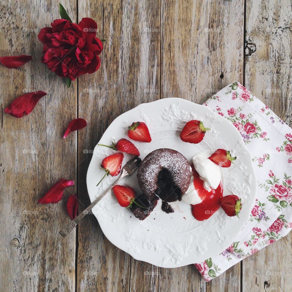 Delicious chocolate fondant with ice cream and strawberry