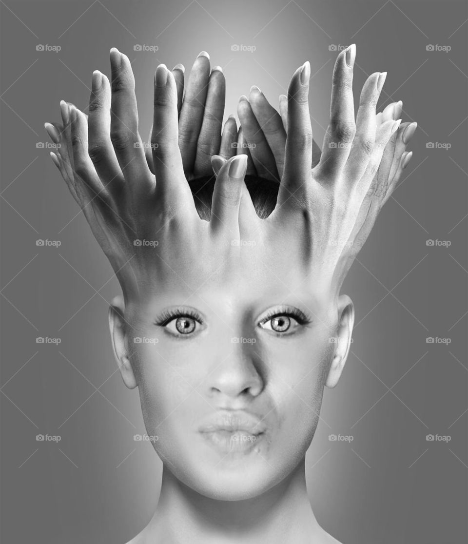 Fingers over the woman's head