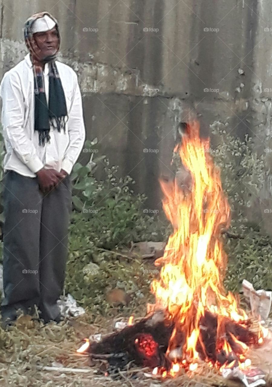 Man standing near fire