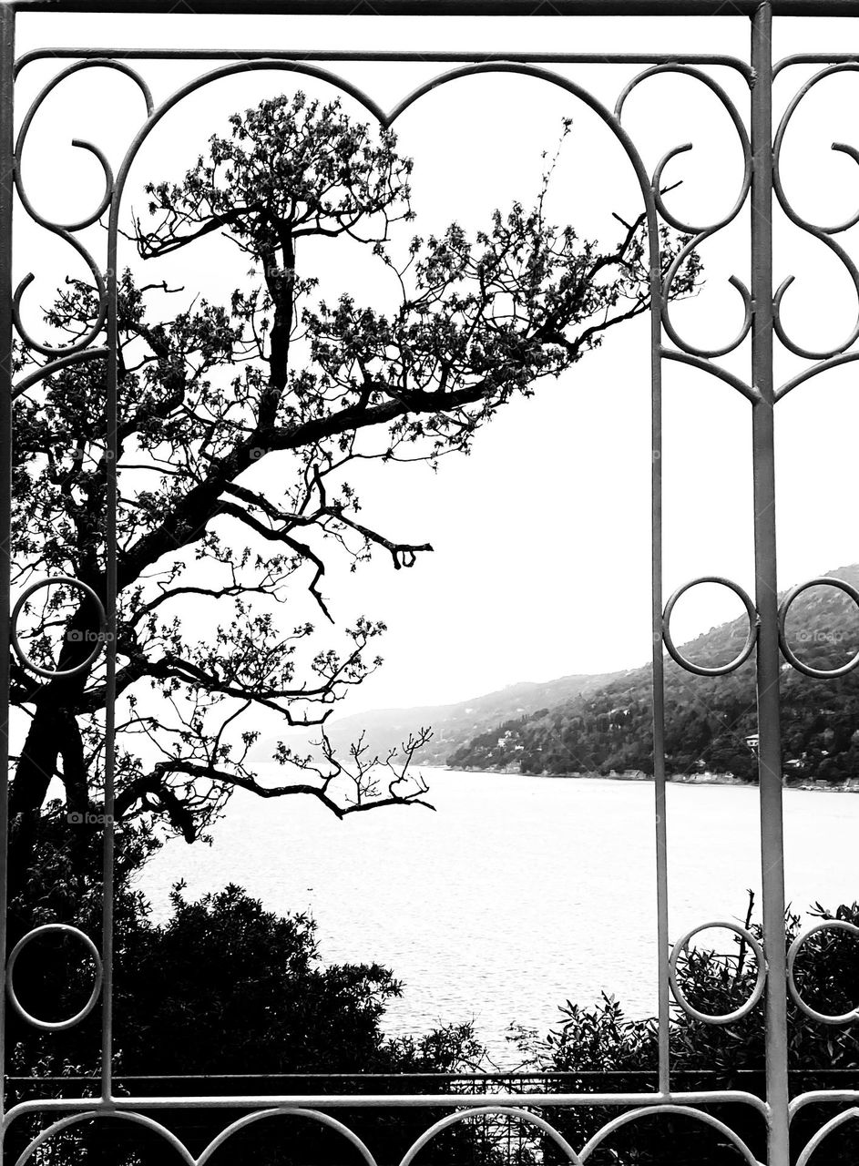 Window above the sea, in black and white 