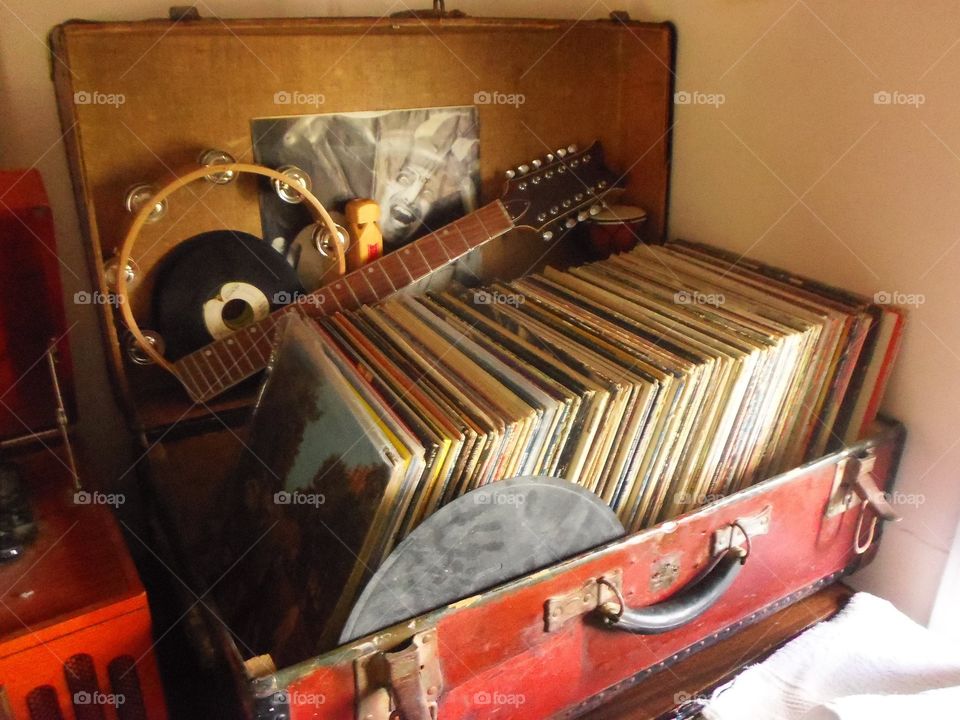 Vinyl records in a vintage trunk.