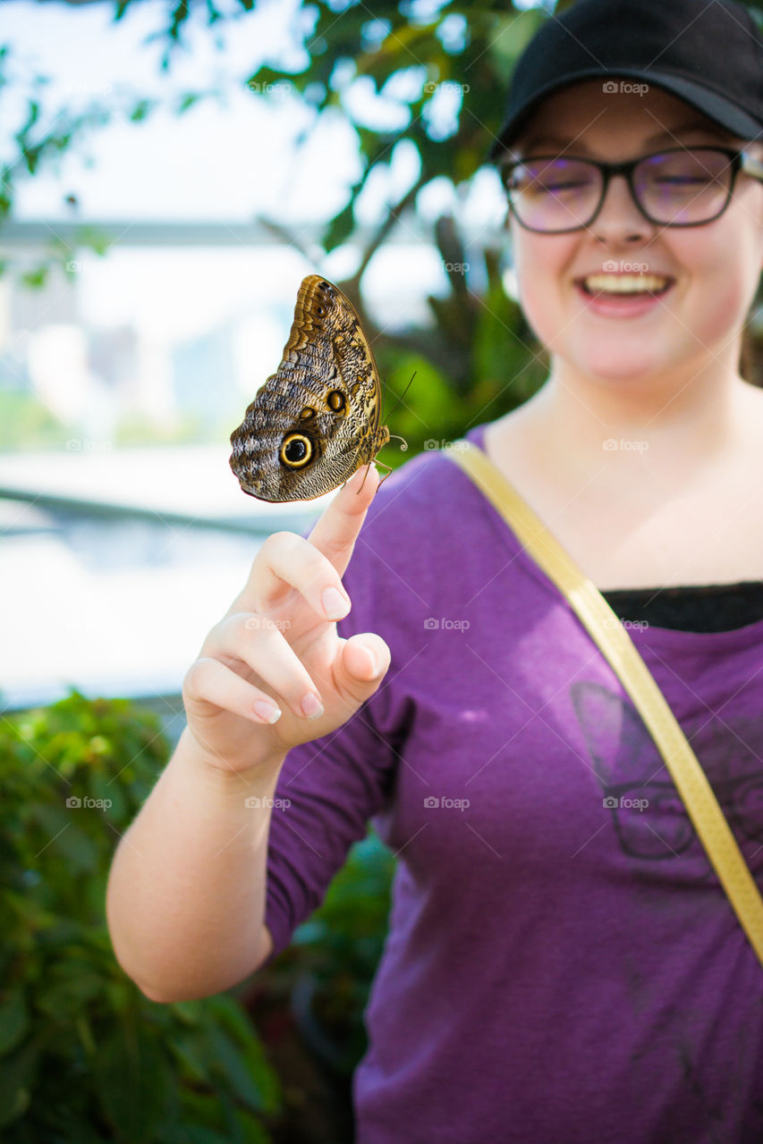 Large Butterfly on a Young Girls Hand 2