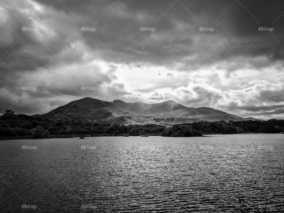 Ray of light hitting a mountain on an island. 