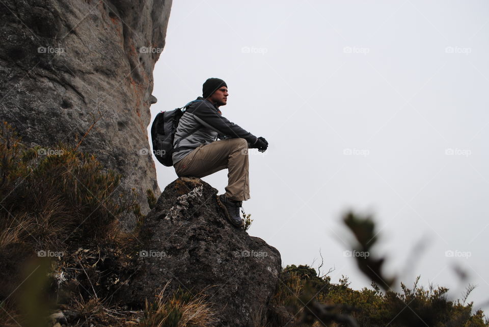 Hiker sitting on rock