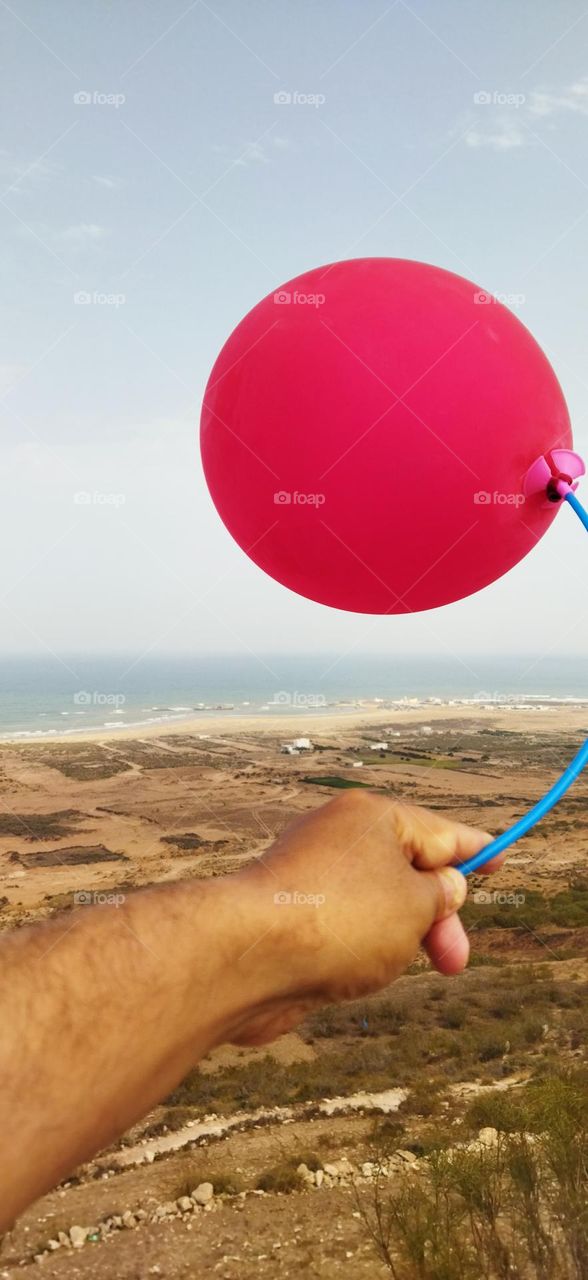 Splendid red ballon and fantastic view to sea.