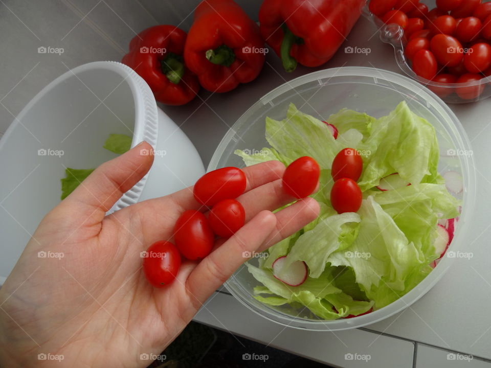 Person preparing salad