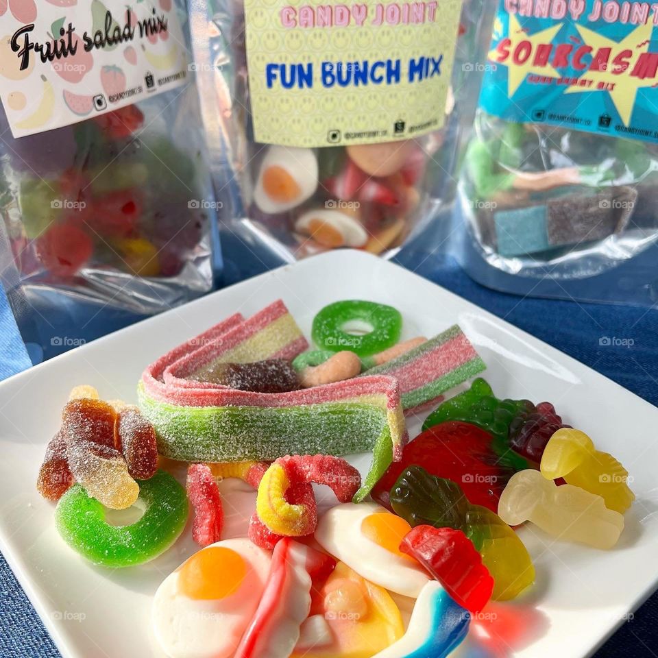 Assorted colourful rainbow fun gummies and sour strips