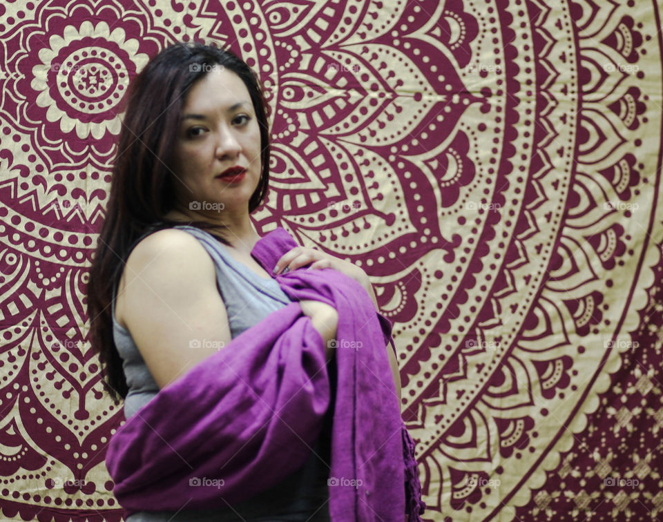 Woman wearing purple mexican rebozo scarf