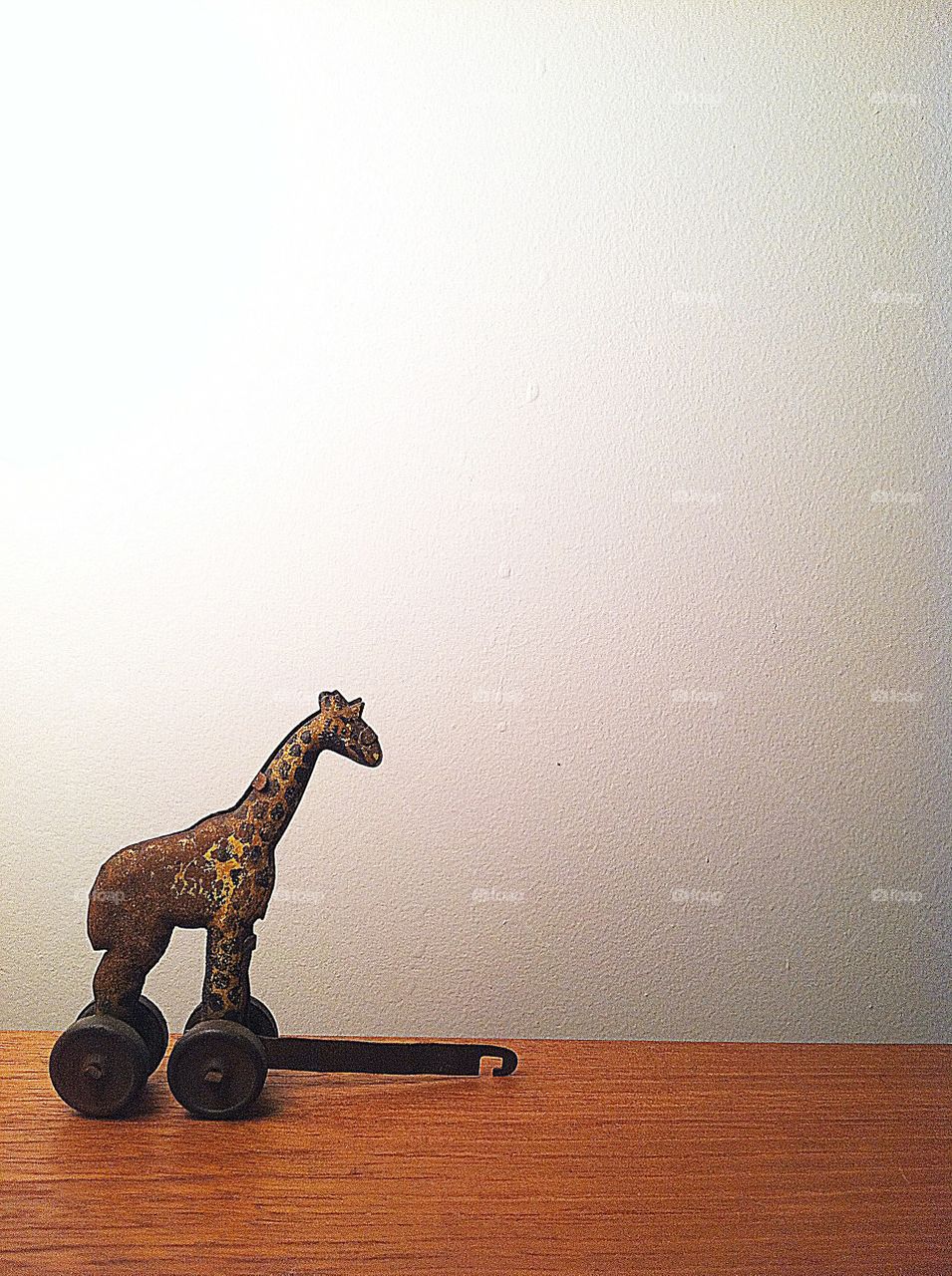 Antique Rolling Giraffe Toy