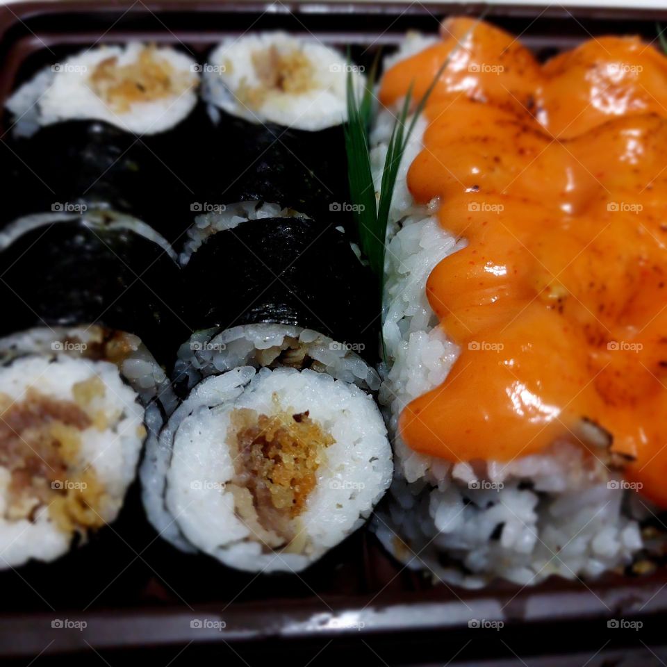 assorted sushi served in a container