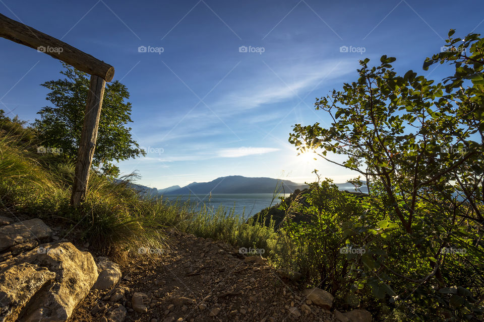 Walking on a path in the woods around the "Rocca di Manerba", lake Garda, Italy.