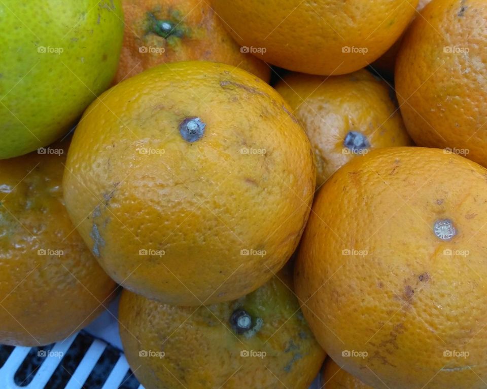 Fresh orange fruits on market