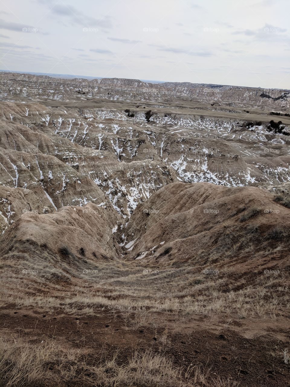 Badlands, South Dakota. Snow still showing in the hills and valleys. Beautiful day in early April.