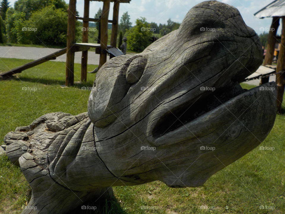 Wooden dog in wooden playground 