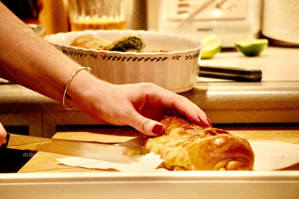 Cutting stuffed bread appetizer 