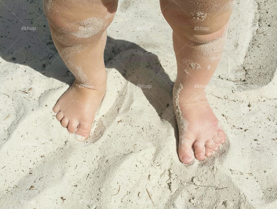 Baby feet on beach