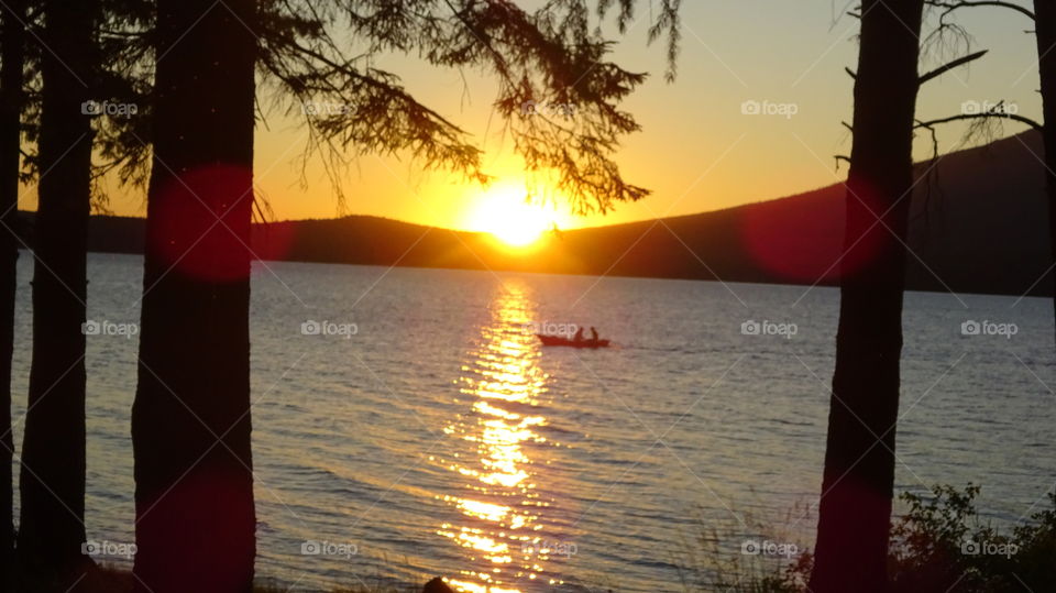 sunset on the pond near the mountain Kachkanar in the Urals