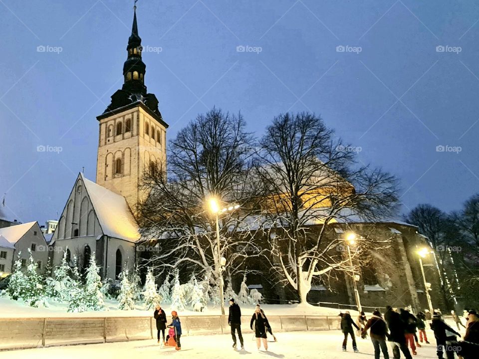 Ice skating in winter, Niguliste Church, Tallinn