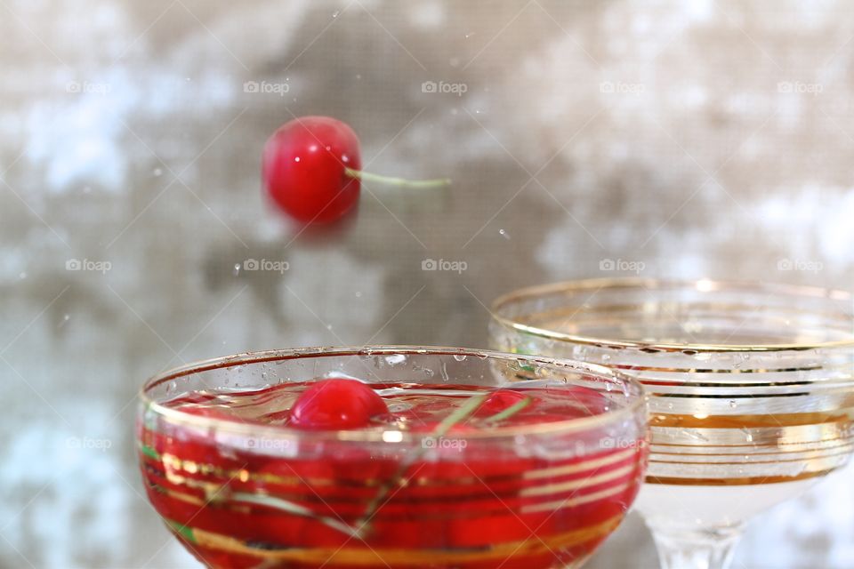 red cherry and champagne glasses