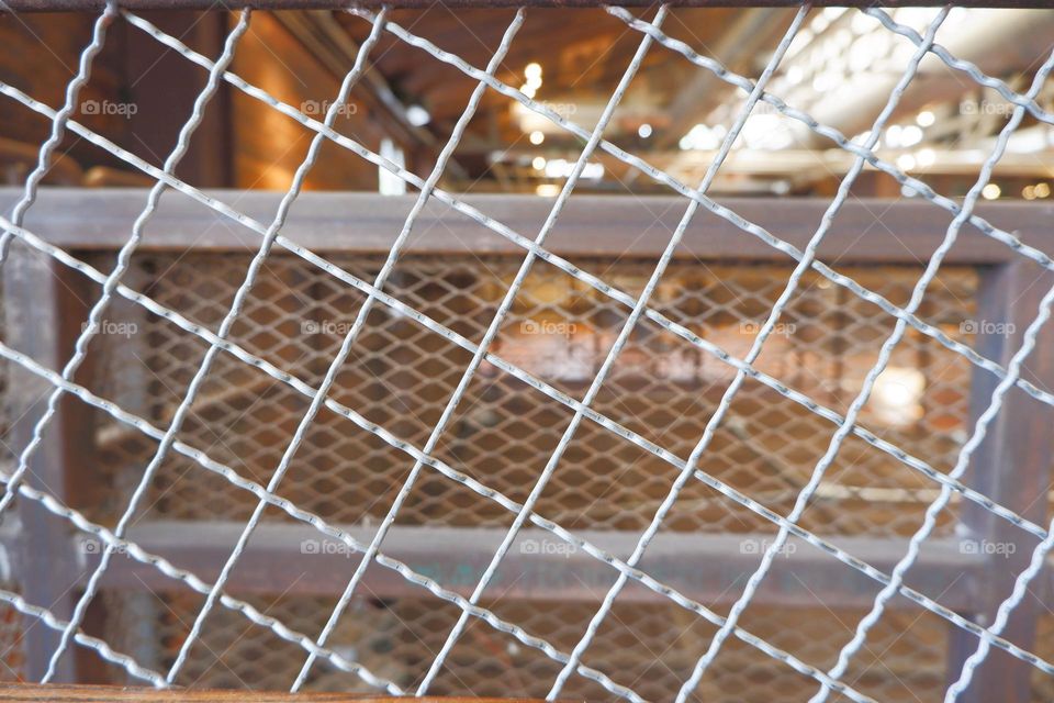 Rectangular steel mesh, placed as a barrier, with a steel background. for making vintage vintage