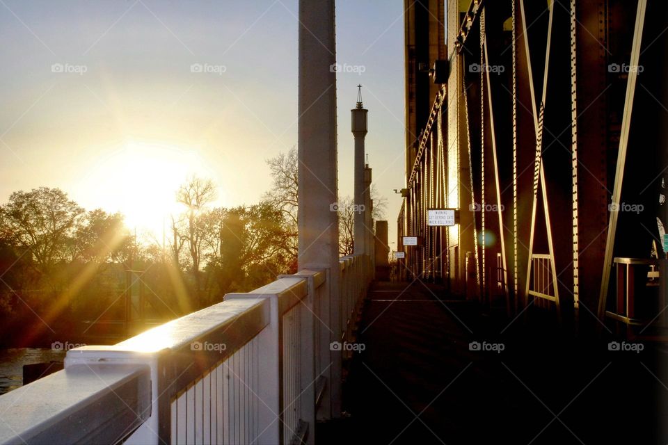 Golden hour sunset on a Golden bridge in the city of Sacramento California