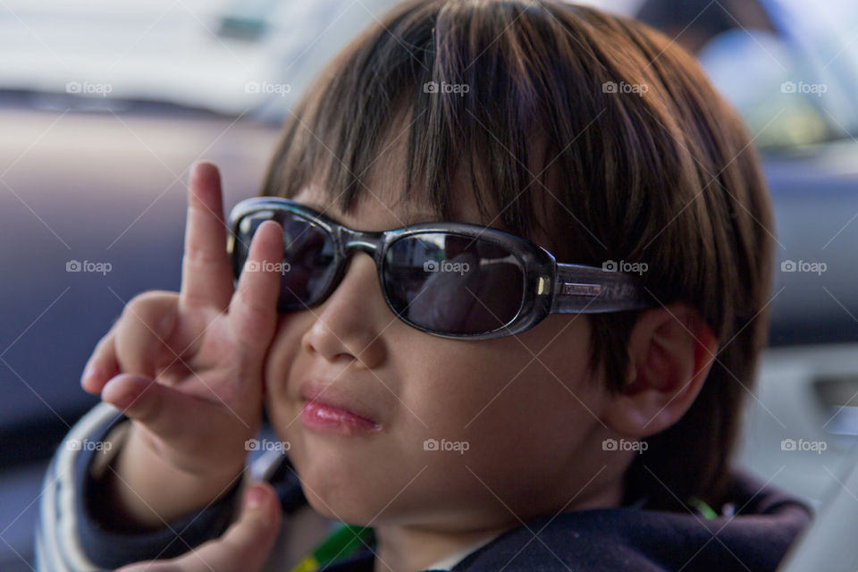 Boy wearing sun glasses