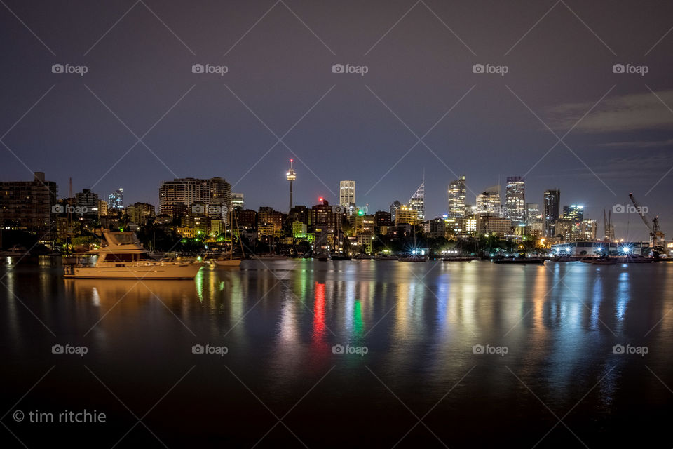 A Garden Island crane, downtown lights, Elizabeth Bay apartments and a yacht asleep in Rushcutters Bay - Sydney before dawn