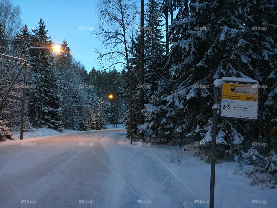 Bus stop at a snowy nuuksio national park 