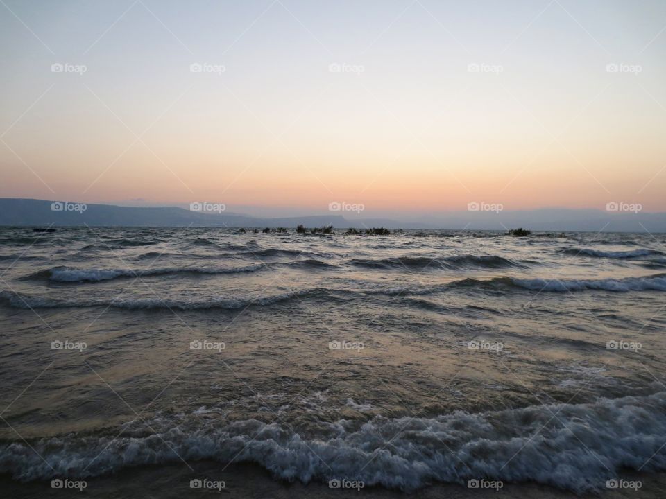 Shoreline at Dusk. Sunset over the sea. 