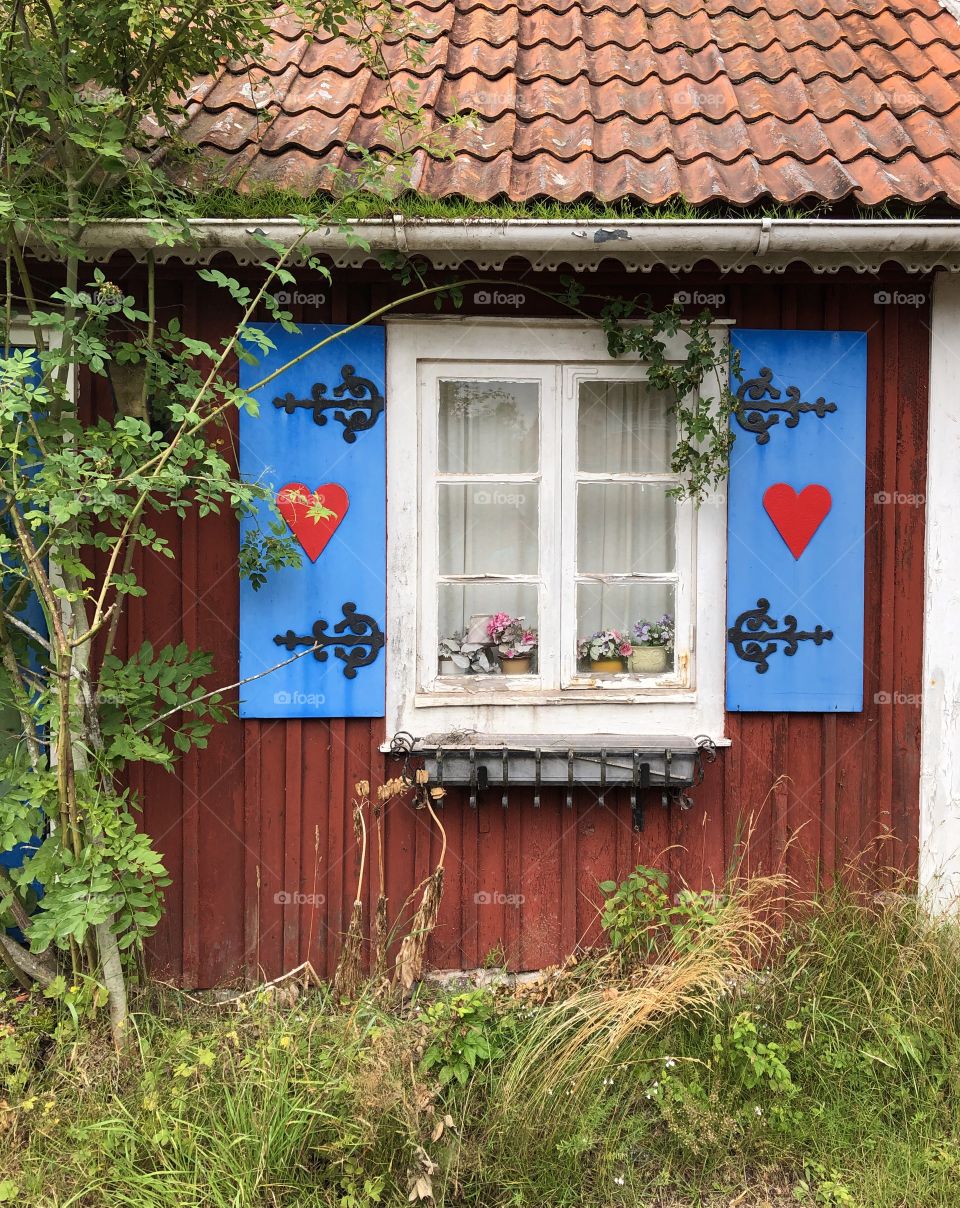 Lovely windows with hearts, countryside cottage