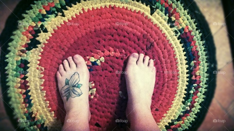 my feet in my T-shirt rug.