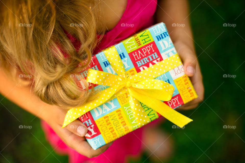 Little girl with present box . Happy birthday 