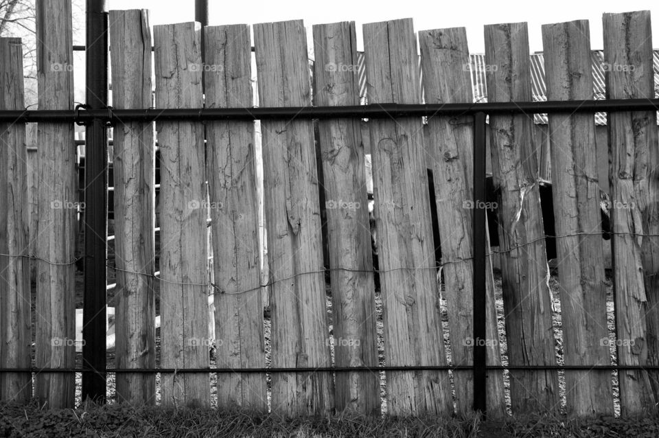 Picket fence and rail. Black and white picket fence with metal rail.  