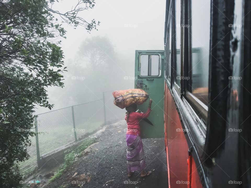 This woman travels daily by this bus to the nearby town to sell her goods, living in a small village where the transportation is very rare, this bus is her boon