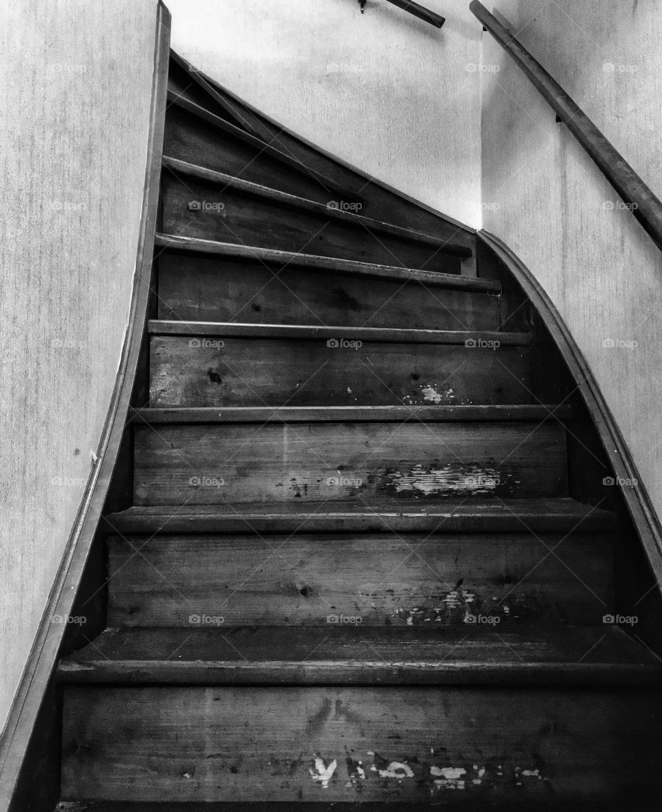 Black and white photo of an old staircase—taken in Ludington, Michigan 