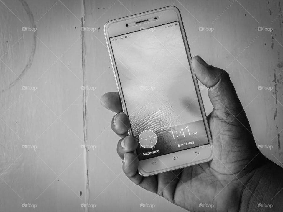 Smartphone /Android /Mobile caught in hand -My favorite gadget. It is black and white photography.