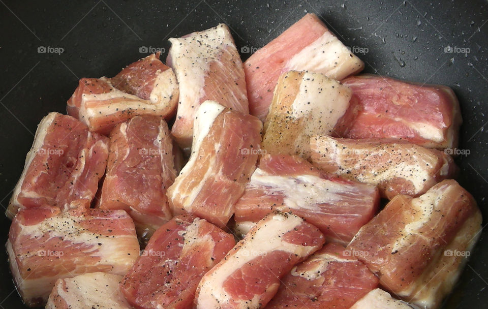Preparing pork meat for dinner at home