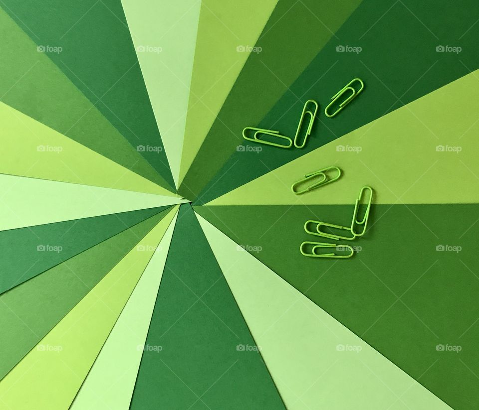 Close-up of green paper clips