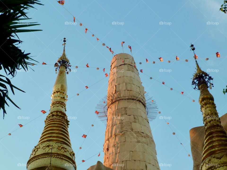 Peace flags wave from a golden tower